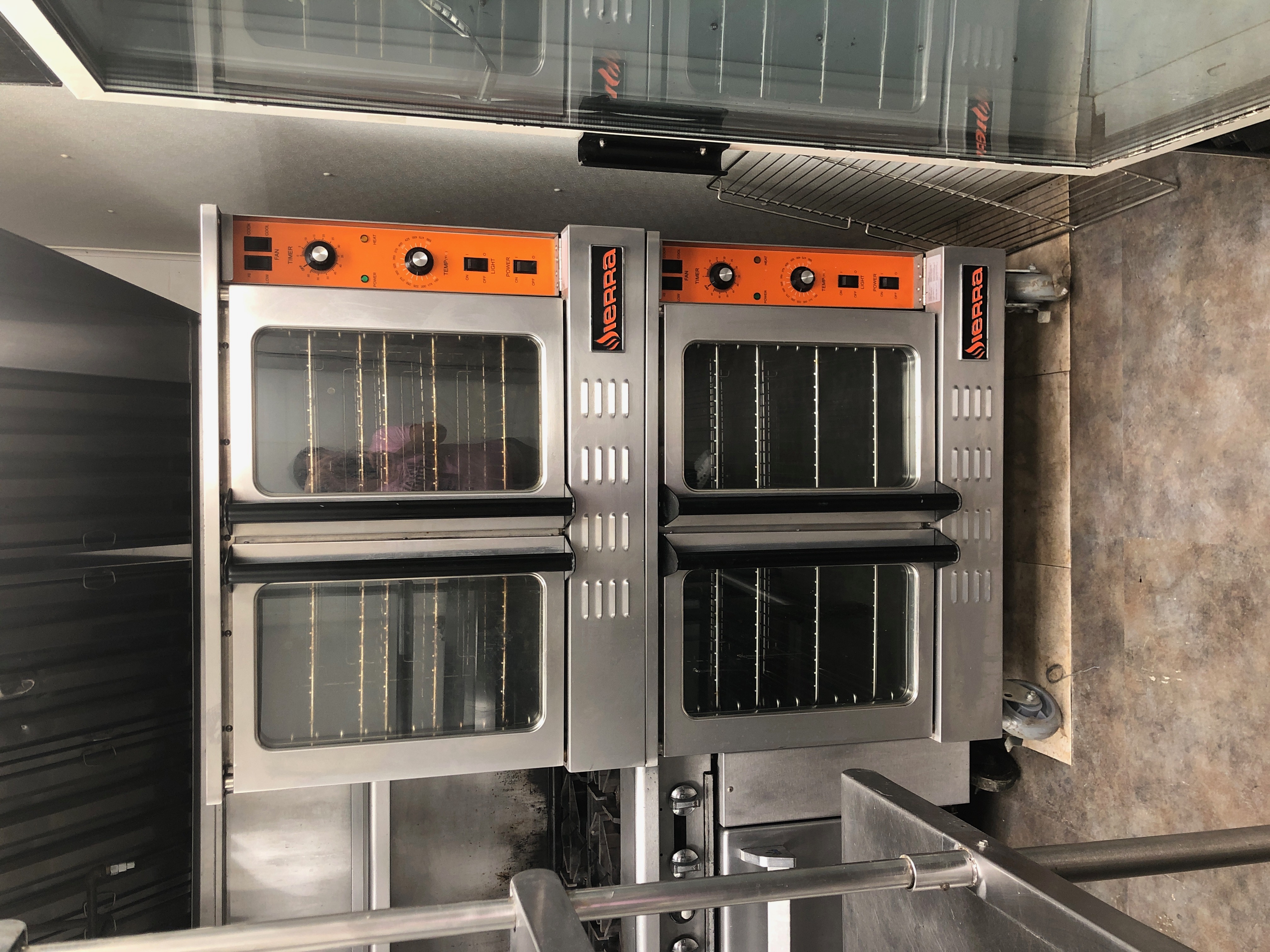 Stacked commercial convection ovens at the Brookhaven kitchen