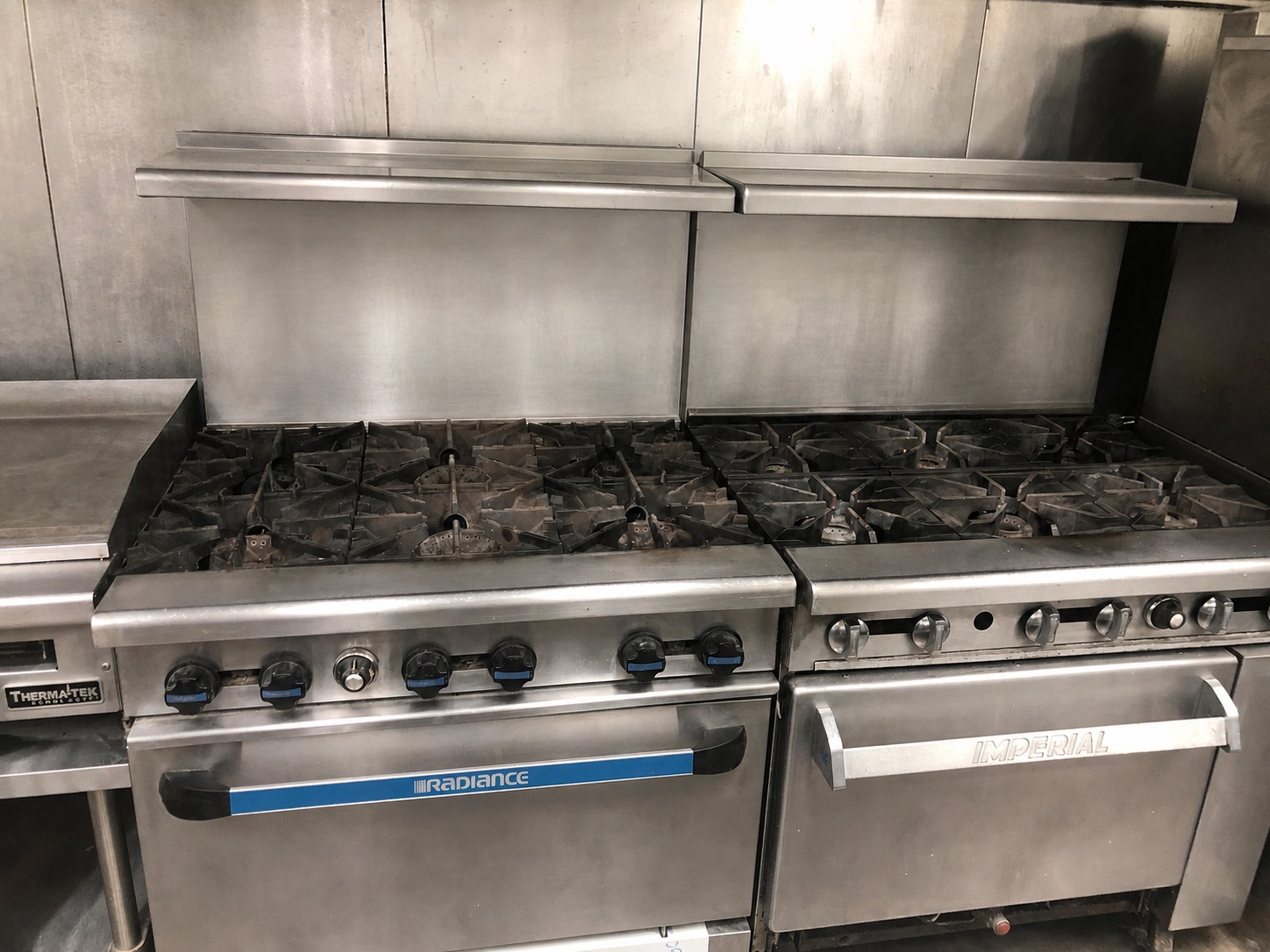 Two commercial cooking ranges under the Brookhaven kitchen hood