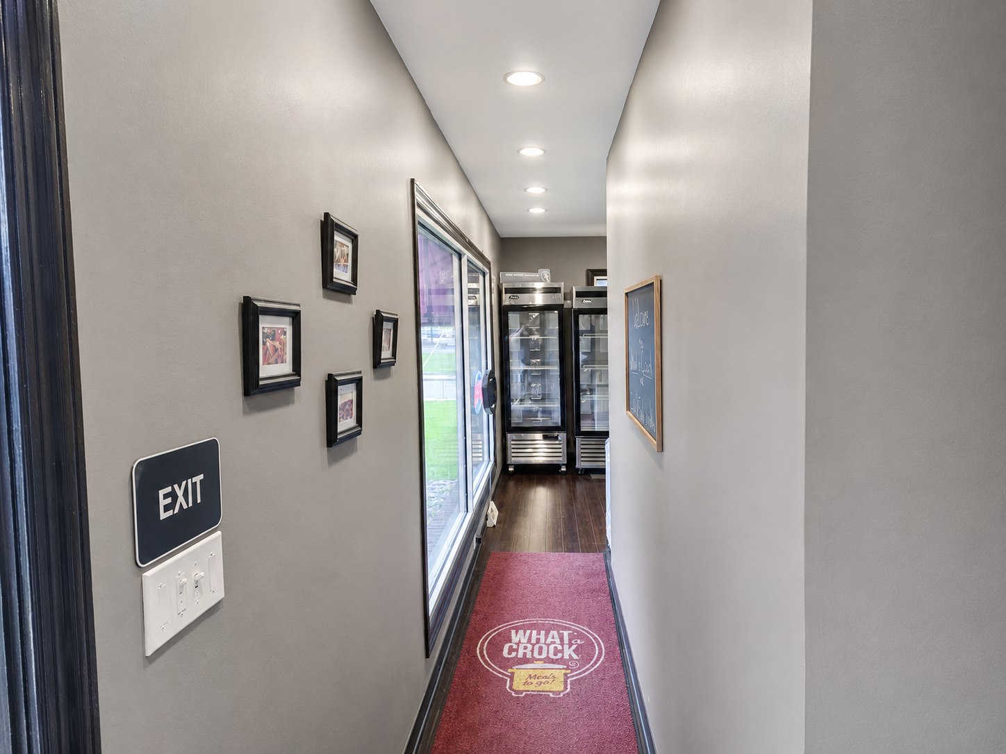 Front corridor with windows and refrigeration visible ahead