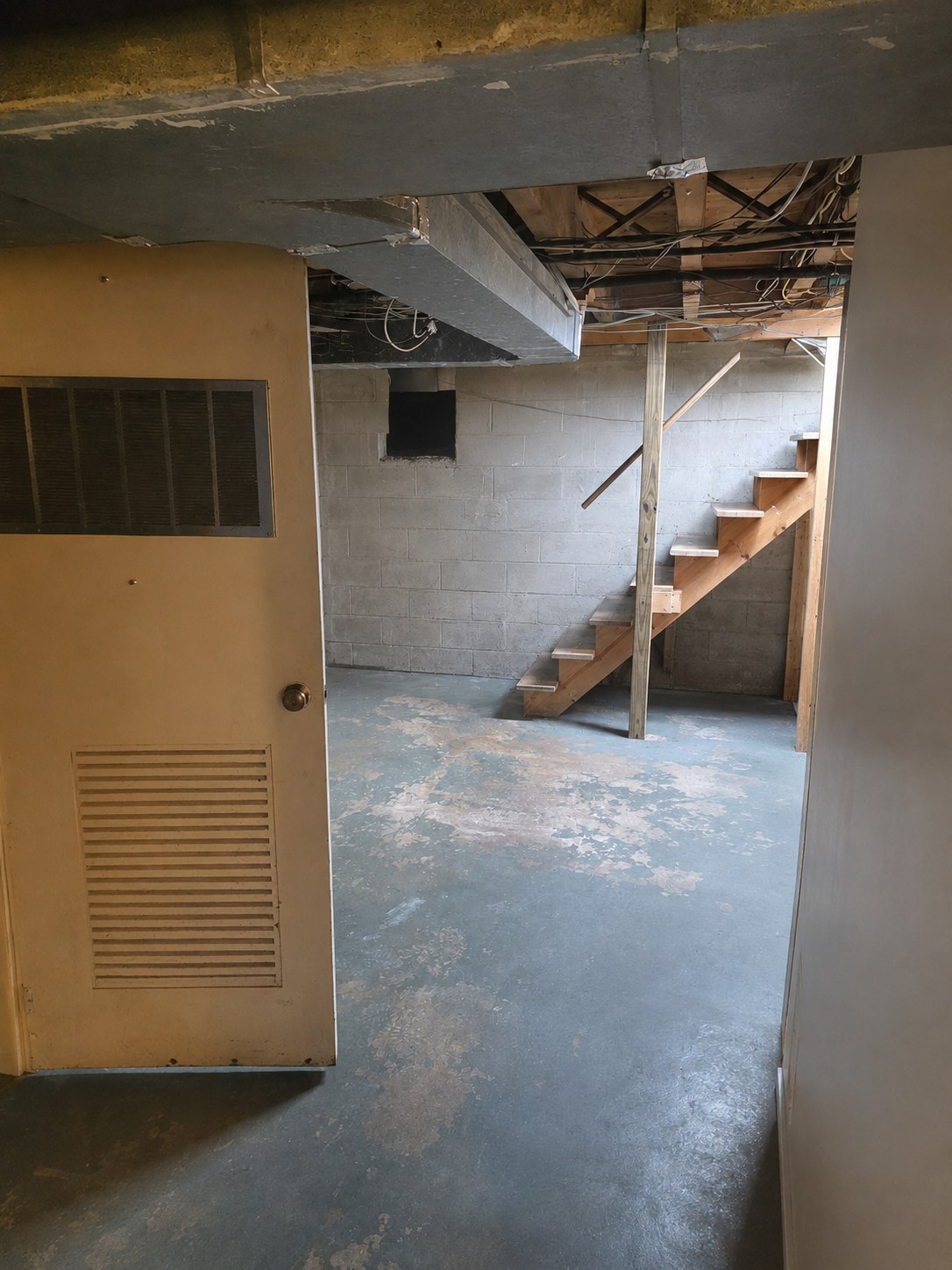 Lower-level stair and utility access area