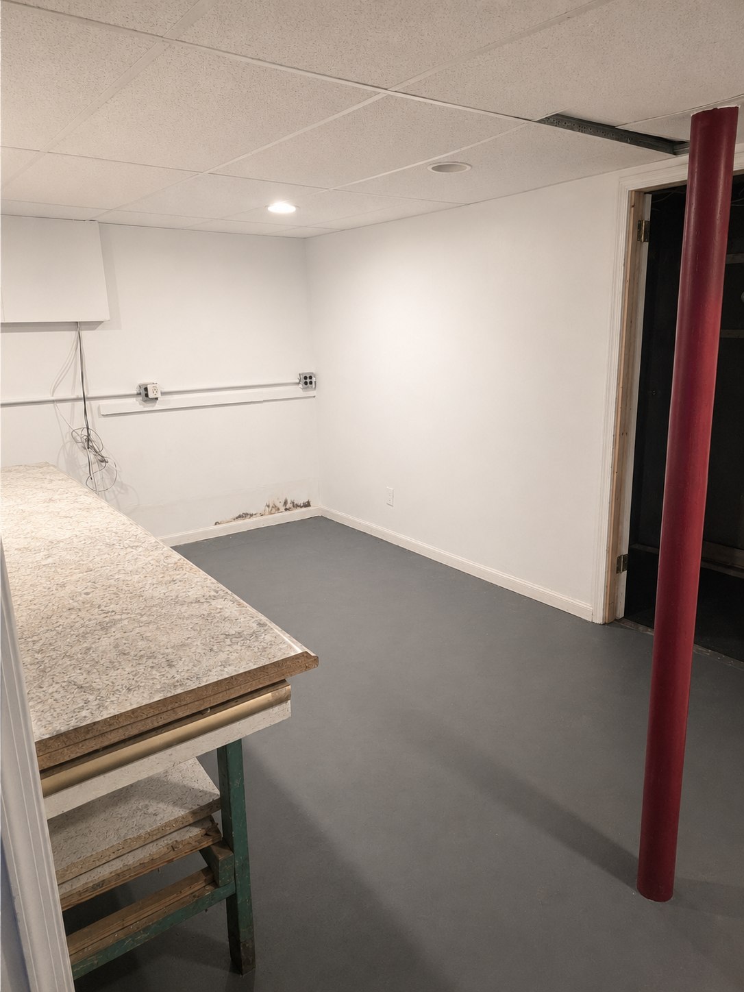Reverse view of the lower-level workroom and counter